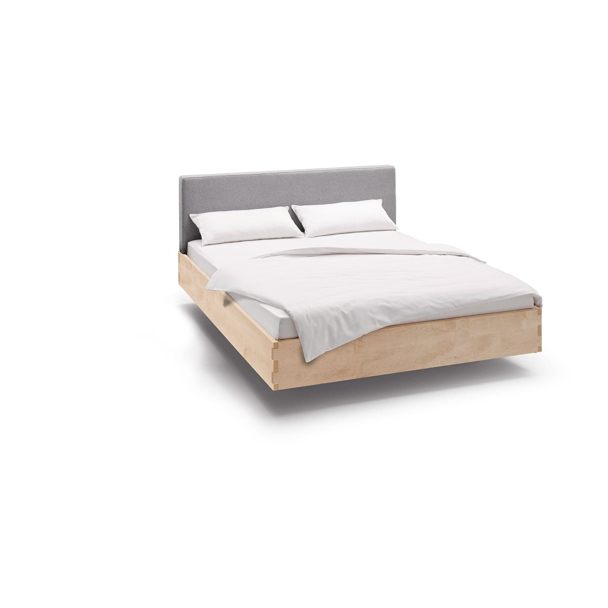 Schwebende Massivholzbett mit Polsterkopfteil aus Ahorn